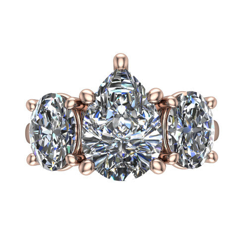 Imogen pear three stone engagement ring in 18K Rose Gold, top-down view showing the center diamond flanked by two round side stones in a classic three stone setting