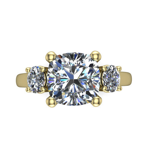 Imogen cushion three stone engagement ring in 18K Yellow Gold, top-down view showing the center diamond flanked by two round side stones in a classic three stone setting