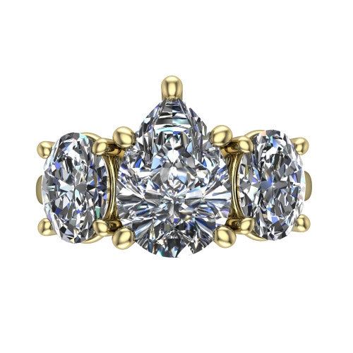 Imogen pear three stone engagement ring in 18K Yellow Gold, top-down view showing the center diamond flanked by two round side stones in a classic three stone setting