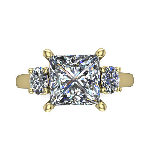Imogen princess three stone engagement ring in 14K Yellow Gold, top-down view showing the center diamond flanked by two round side stones in a classic three stone setting
