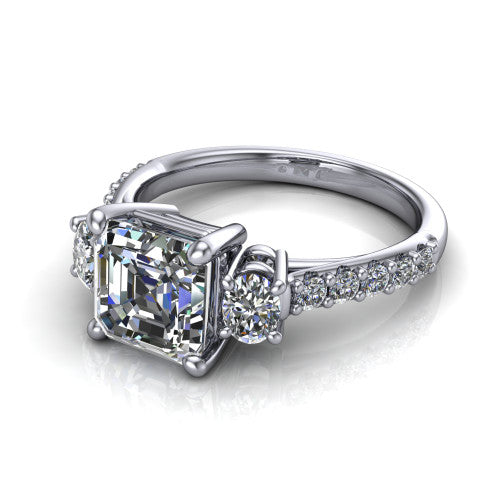 Poppy asscher three stone engagement ring in Platinum, three-quarter perspective showing the center diamond between two round side stones above a pav&eacute; shank