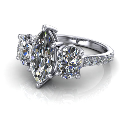 Poppy marquise three stone engagement ring in Platinum, three-quarter perspective showing the center diamond between two round side stones above a pav&eacute; shank