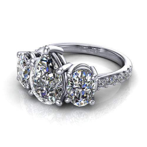 Poppy pear three stone engagement ring in 14K White Gold, three-quarter perspective showing the center diamond between two round side stones above a pav&eacute; shank