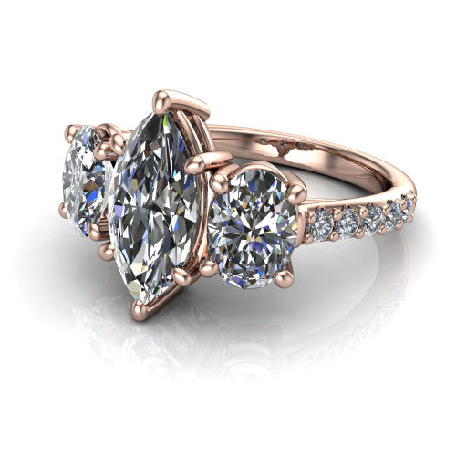 Poppy marquise three stone engagement ring in 18K Rose Gold, three-quarter perspective showing the center diamond between two round side stones above a pav&eacute; shank