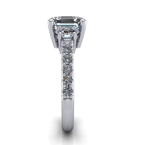 Poppy asscher three stone engagement ring in Platinum, side profile showing the round side stone and the pav&eacute; diamonds running down the shank