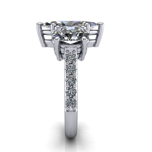 Poppy marquise three stone engagement ring in 14K White Gold, side profile showing the round side stone and the pav&eacute; diamonds running down the shank