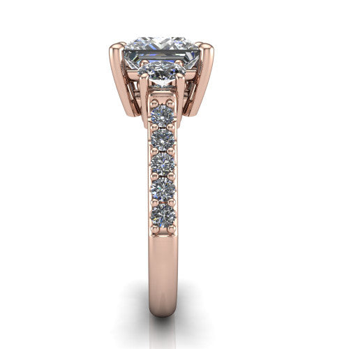 Poppy princess three stone engagement ring in 18K Rose Gold, top-down view showing the center diamond flanked by two round side stones in a classic three stone setting