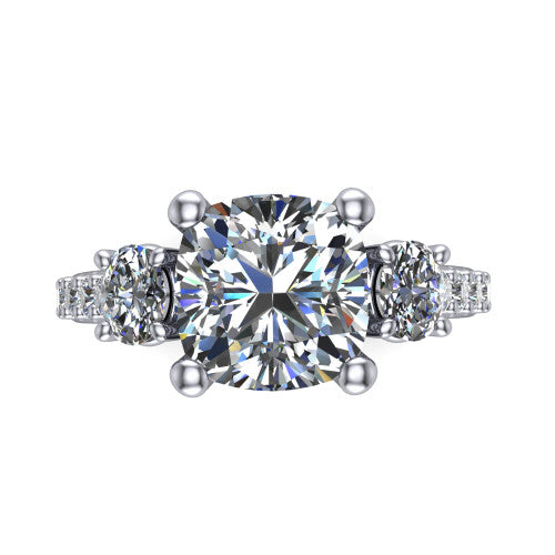 Poppy cushion three stone engagement ring in 14K White Gold, top-down view showing the center diamond flanked by two round side stones in a classic three stone setting