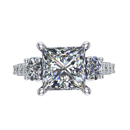 Poppy princess three stone engagement ring in 18K White Gold, top-down view showing the center diamond flanked by two round side stones in a classic three stone setting