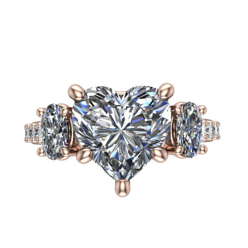Poppy heart three stone engagement ring in 14K Rose Gold, top-down view showing the center diamond flanked by two round side stones in a classic three stone setting