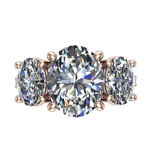 Poppy oval three stone engagement ring in 18K Rose Gold, top-down view showing the center diamond flanked by two round side stones in a classic three stone setting