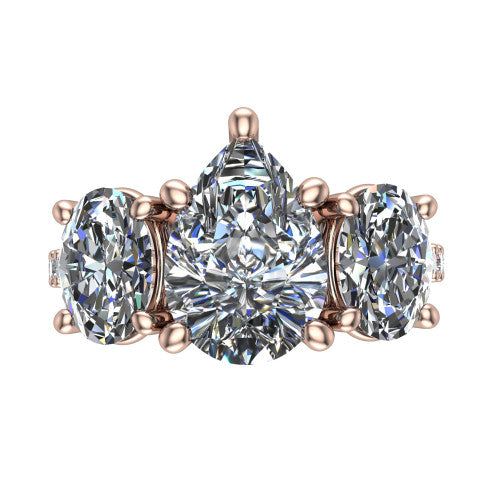 Poppy pear three stone engagement ring in 18K Rose Gold, top-down view showing the center diamond flanked by two round side stones in a classic three stone setting