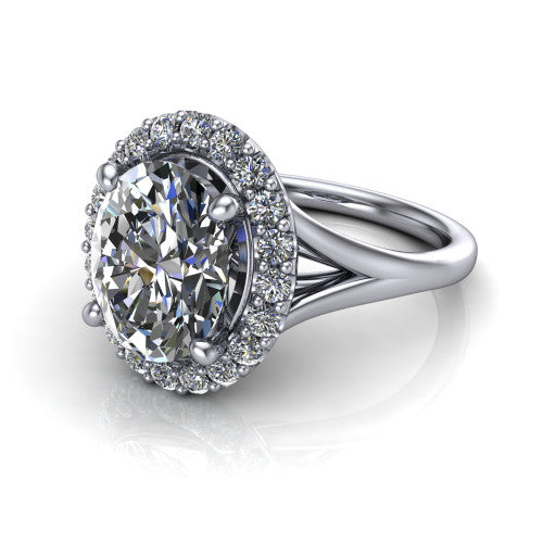 Seraphina oval halo engagement ring in 18K White Gold, three-quarter perspective showing the haloed center raised above a pav&eacute; split shank