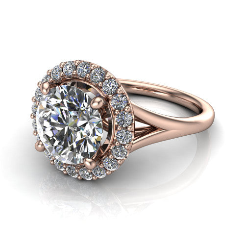 Seraphina round halo engagement ring in 18K Rose Gold, three-quarter perspective showing the haloed center raised above a pav&eacute; split shank