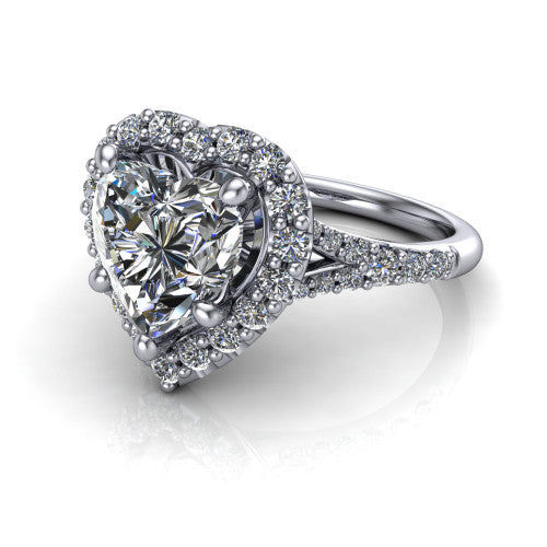Sadie heart halo engagement ring in 18K White Gold, three-quarter perspective showing the milgrain-edged haloed center raised above a pav&eacute; split shank