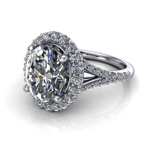Sadie oval halo engagement ring in 18K White Gold, three-quarter perspective showing the milgrain-edged haloed center raised above a pav&eacute; split shank