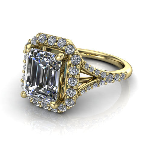 Sadie emerald halo engagement ring in 18K Yellow Gold, three-quarter perspective showing the milgrain-edged haloed center raised above a pav&eacute; split shank