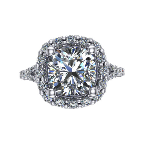 Sadie cushion halo engagement ring in Platinum, top-down view showing the center diamond framed by a milgrain-edged pav&eacute; halo where the split shank meets the head