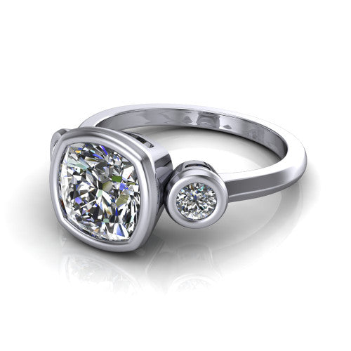 Daisy cushion three stone engagement ring in 18K White Gold, three-quarter perspective showing the bezel-set center between two bezel-set round side stones on a slim polished band