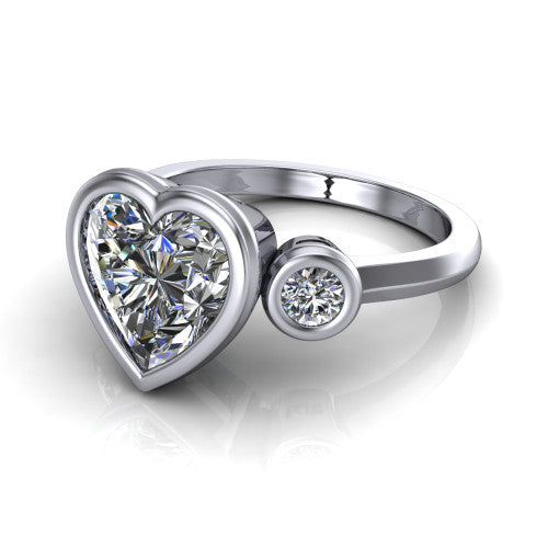 Daisy heart three stone engagement ring in Platinum, three-quarter perspective showing the bezel-set center between two bezel-set round side stones on a slim polished band