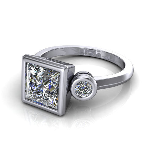 Daisy princess three stone engagement ring in 14K White Gold, three-quarter perspective showing the bezel-set center between two bezel-set round side stones on a slim polished band
