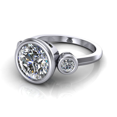 Daisy round three stone engagement ring in 18K White Gold, three-quarter perspective showing the bezel-set center between two bezel-set round side stones on a slim polished band