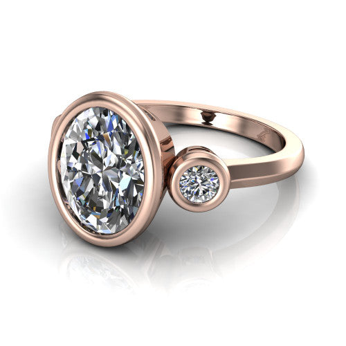 Daisy oval three stone engagement ring in 18K Rose Gold, three-quarter perspective showing the bezel-set center between two bezel-set round side stones on a slim polished band