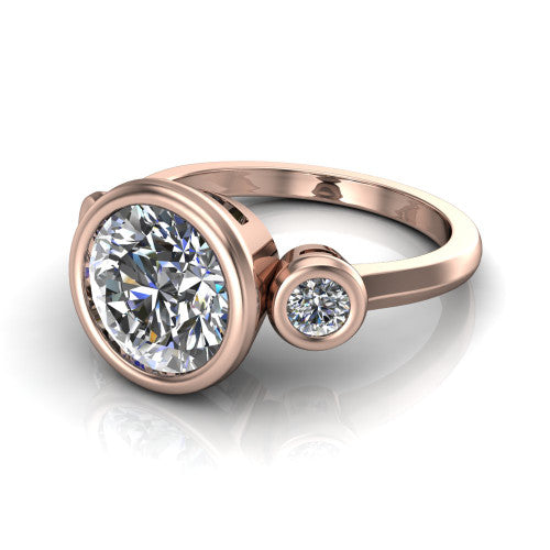 Daisy round three stone engagement ring in 14K Rose Gold, three-quarter perspective showing the bezel-set center between two bezel-set round side stones on a slim polished band