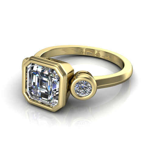 Daisy asscher three stone engagement ring in 18K Yellow Gold, three-quarter perspective showing the bezel-set center between two bezel-set round side stones on a slim polished band