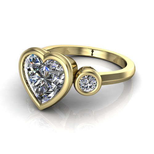 Daisy heart three stone engagement ring in 18K Yellow Gold, three-quarter perspective showing the bezel-set center between two bezel-set round side stones on a slim polished band