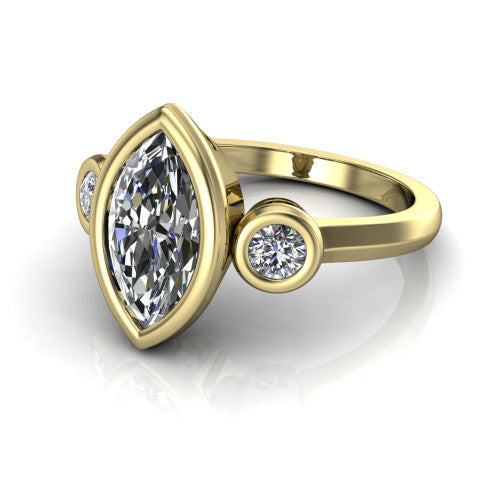 Daisy marquise three stone engagement ring in 18K Yellow Gold, three-quarter perspective showing the bezel-set center between two bezel-set round side stones on a slim polished band
