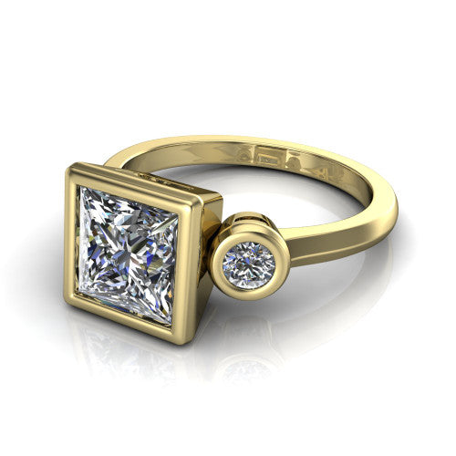Daisy princess three stone engagement ring in 18K Yellow Gold, three-quarter perspective showing the bezel-set center between two bezel-set round side stones on a slim polished band