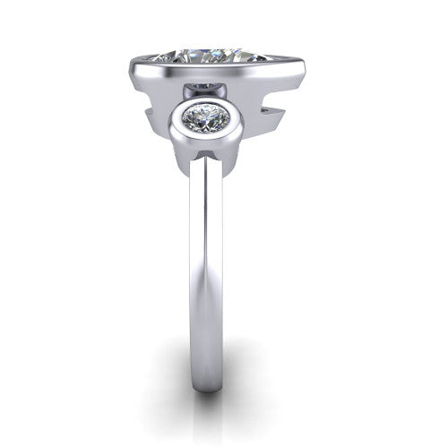 Daisy pear three stone engagement ring in Platinum, side profile showing the bezel-set round side stone and the smooth polished band