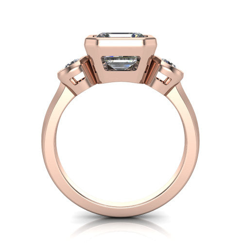 Daisy asscher three stone engagement ring in 18K Rose Gold, through-finger front profile showing the three-stone bezel head raised above the slim polished shank