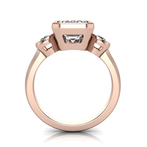Daisy emerald three stone engagement ring in 18K Rose Gold, through-finger front profile showing the three-stone bezel head raised above the slim polished shank