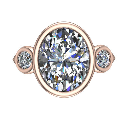 Daisy oval three stone engagement ring in 18K Rose Gold, top-down view showing the bezel-set center diamond flanked by two round bezel-set side stones