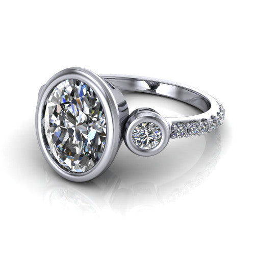 Chloe oval three stone engagement ring in 14K White Gold, three-quarter perspective showing the bezel-set center between two bezel-set round side stones above a pav&eacute; shank