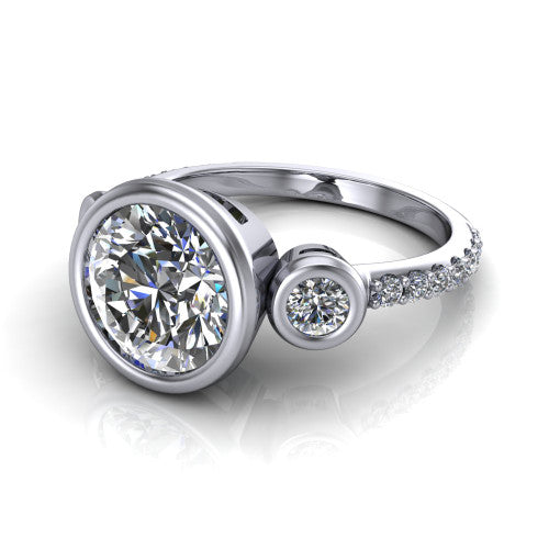 Chloe round three stone engagement ring in 18K White Gold, three-quarter perspective showing the bezel-set center between two bezel-set round side stones above a pav&eacute; shank