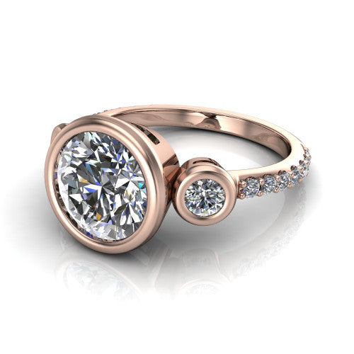 Chloe round three stone engagement ring in 18K Rose Gold, three-quarter perspective showing the bezel-set center between two bezel-set round side stones above a pav&eacute; shank