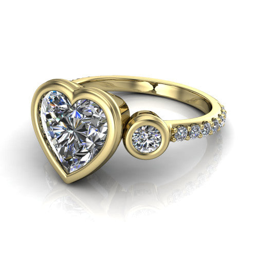 Chloe heart three stone engagement ring in 18K Yellow Gold, three-quarter perspective showing the bezel-set center between two bezel-set round side stones above a pav&eacute; shank