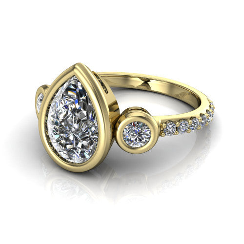 Chloe pear three stone engagement ring in 18K Yellow Gold, three-quarter perspective showing the bezel-set center between two bezel-set round side stones above a pav&eacute; shank