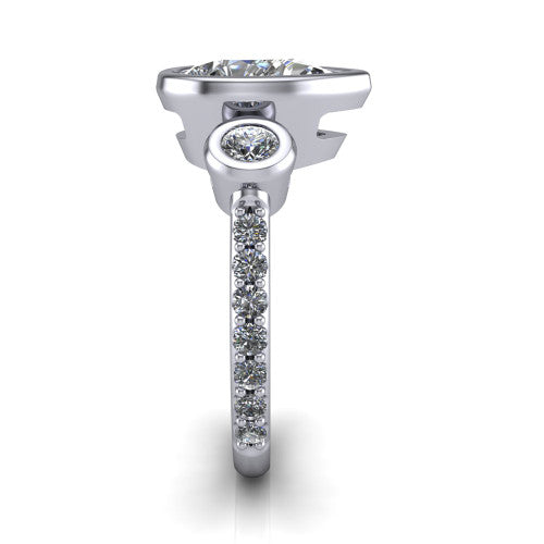Chloe pear three stone engagement ring in 18K White Gold, side profile showing the round bezel side stone and the pav&eacute; diamonds running down the shank