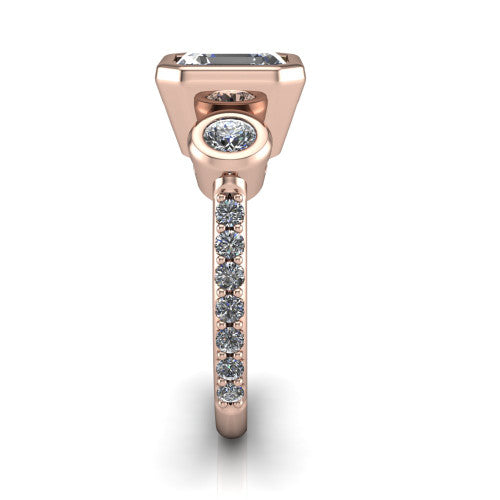 Chloe asscher three stone engagement ring in 18K Rose Gold, side profile showing the round bezel side stone and the pav&eacute; diamonds running down the shank