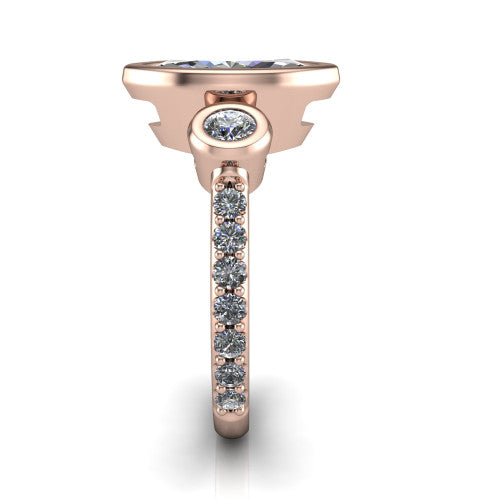 Chloe marquise three stone engagement ring in 18K Rose Gold, side profile showing the round bezel side stone and the pav&eacute; diamonds running down the shank