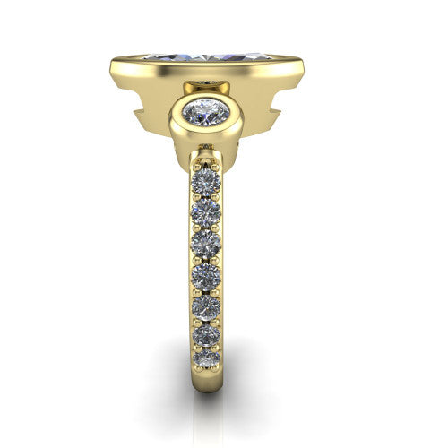 Chloe marquise three stone engagement ring in 14K Yellow Gold, side profile showing the round bezel side stone and the pav&eacute; diamonds running down the shank