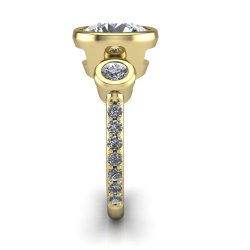 Chloe round three stone engagement ring in 14K Yellow Gold, side profile showing the round bezel side stone and the pav&eacute; diamonds running down the shank