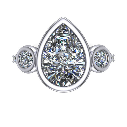 Chloe pear three stone engagement ring in 18K White Gold, top-down view showing the bezel-set center flanked by two round side stones in bezels over a pav&eacute; band