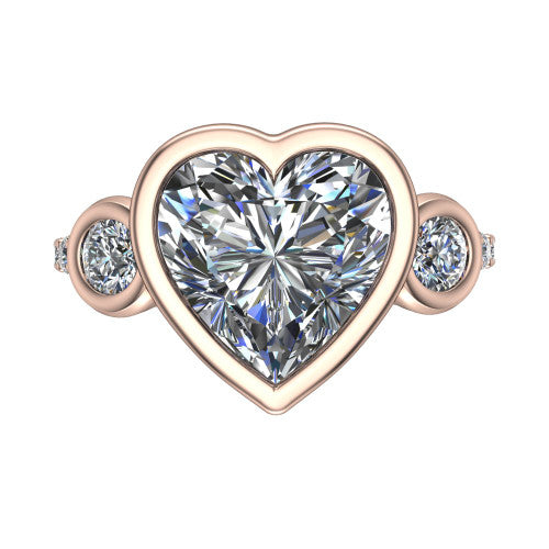 Chloe heart three stone engagement ring in 14K Rose Gold, top-down view showing the bezel-set center flanked by two round side stones in bezels over a pav&eacute; band