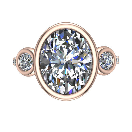 Chloe oval three stone engagement ring in 18K Rose Gold, top-down view showing the bezel-set center flanked by two round side stones in bezels over a pav&eacute; band
