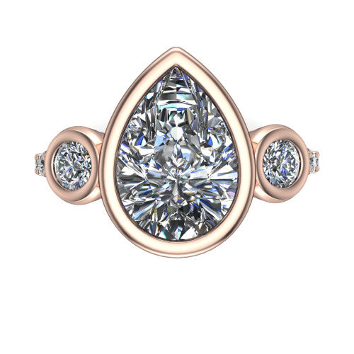 Chloe pear three stone engagement ring in 14K Rose Gold, top-down view showing the bezel-set center flanked by two round side stones in bezels over a pav&eacute; band